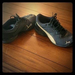 Puma black and gold sneakers